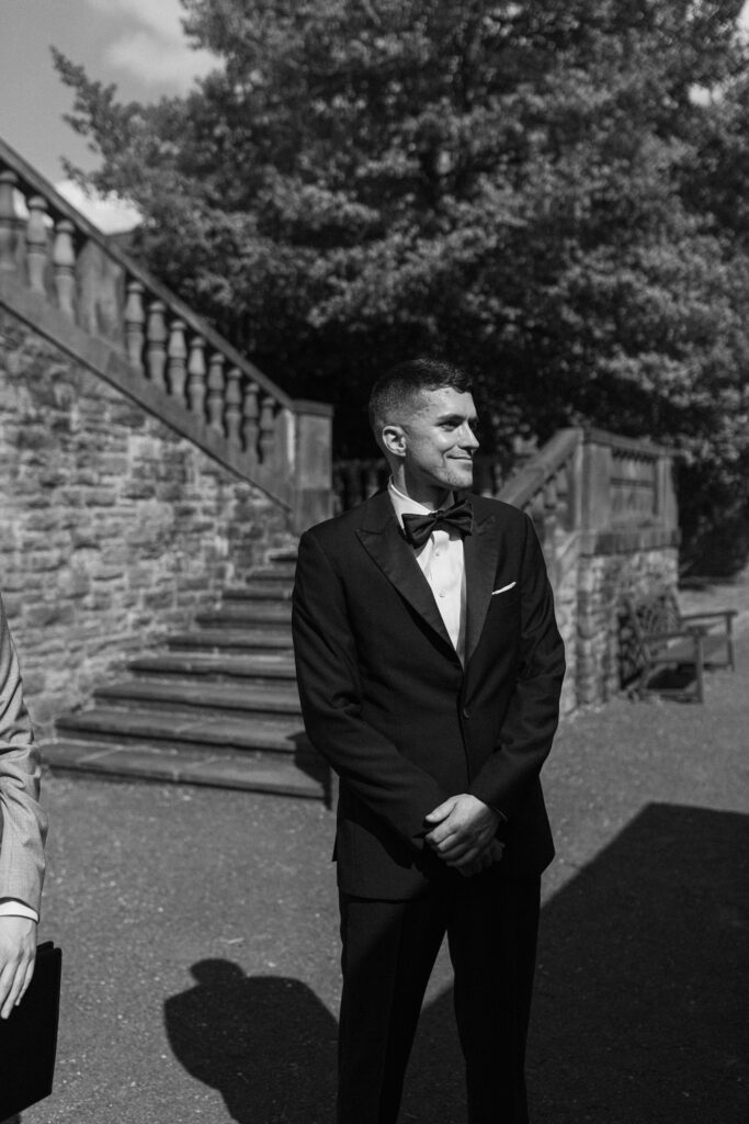 The groom anticipates his bride walking down the aisle